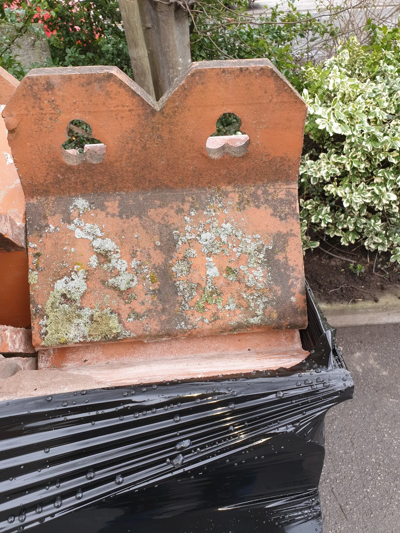 A reclaimed terracotta finial above stacked slate in the Hunslet yard
